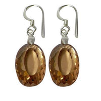 Cargar imagen en el visor de la galería, These Silberohrringe Ohrhänger feature oval-facettierten Zirkonia in amber tones, set in 925er Sterlingsilber, displayed against a white background.
