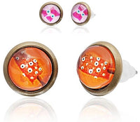 Load image into Gallery viewer, Two pairs of 12mm round, colorful Brass Ohrstecker earrings are shown: one features a red and orange design with white dots, the other a pink and white cartoon owl, both made of nickelfrei, stainless steel, unisex.
