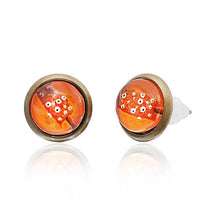 Load image into Gallery viewer, A pair of 12mm round, nickelfrei Brass Ohrstecker earrings featuring a colorful star pattern, bronze-colored rims, and orange glass centers. These unisex stainless steel earrings come with clear plastic backings.
