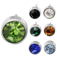 Load image into Gallery viewer, Six round 6mm Brass Ohrstecker earrings, silver-plated with faceted Glaskristall in green, black, white, teal, amber, blue, and light blue. All are nickelfrei for comfort. The green gemstone stands out the most.
