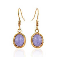 Load image into Gallery viewer, A pair of Brass Ohrringe Ohrhänger für Damen, featuring oval lila Katzenauge gemstones elegantly framed and set on hooked brass ear wires.
