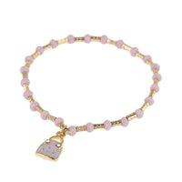 Load image into Gallery viewer, Armband Brass Steine goldfarben Perlen rosa Anhänger Handtasche - chic - net.de
