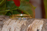 Load image into Gallery viewer, Messing Armreif golden Mondstein Spirale Tropfen Flechtrand nickelfrei verstellbar antik Tribal
