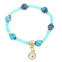Load image into Gallery viewer, Armband Brass golden Zirkonia Charm Kristalle Perlen marmoriert blau verstellbar - chic-net.de
