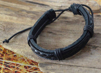 Load image into Gallery viewer, Leder Armband schwarz braun breit umwickelt verstellbar - chic-net.de
