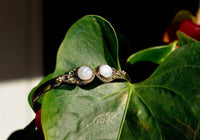 Load image into Gallery viewer, Messing Armreif golden Mondstein rund acht Zopfrand nickelfrei verstellbar antik Tribal Schmuck.
