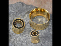 Load image into Gallery viewer, Tunnel Plug Messing Onyx Stein schwarz Rim gold - chic-net.de
