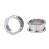 Load image into Gallery viewer, Two Schraubplug Einkerbungen Tunnel Edelstahl Plug silber, one upright and one on its side, are displayed against a white background.

