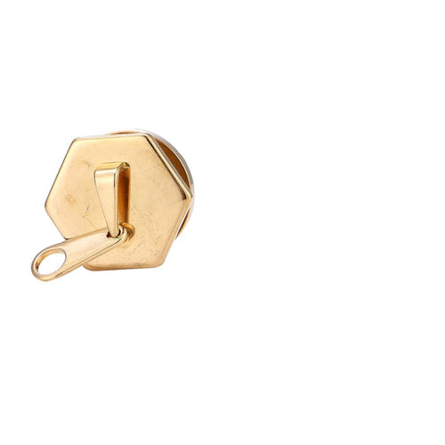 A gold stainless steel Tunnel Plug Schraubplug with a hexagonal shape, flat top, and small pull-tab resembling a zipper accessory, isolated on a white background.